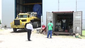 Hon. Alexis Jeffers Minister responsible for Public Utilities on Nevis (extreme left) takes a first-hand look at the new 3.85 megawatt-Wӓrtsilӓ generator being unloaded at the Nevis Electricity Company Limited’s Power Plant at Prospect on June 27, 2017